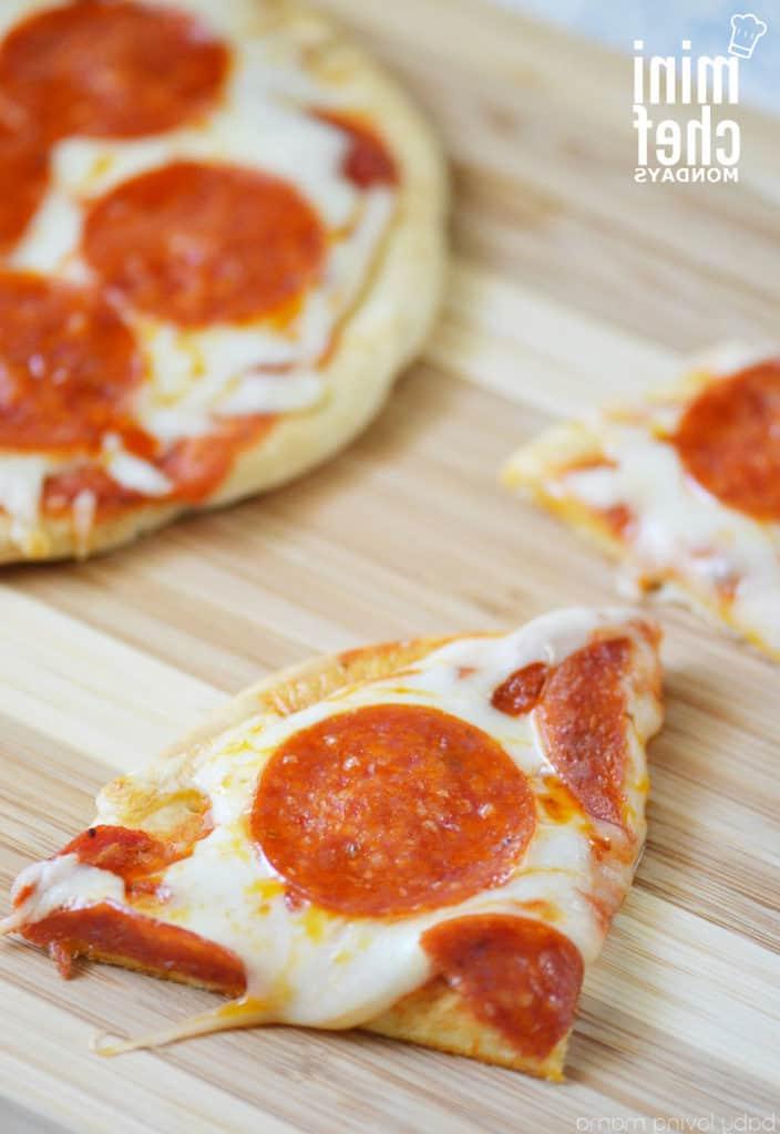 sliced flatbread pizza on cutting board