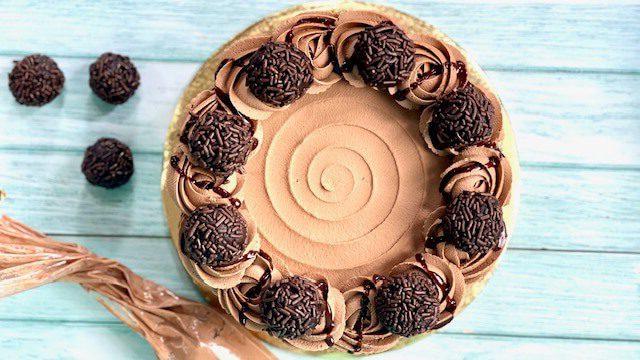 chocolate ganache cake decorated with cake truffles
