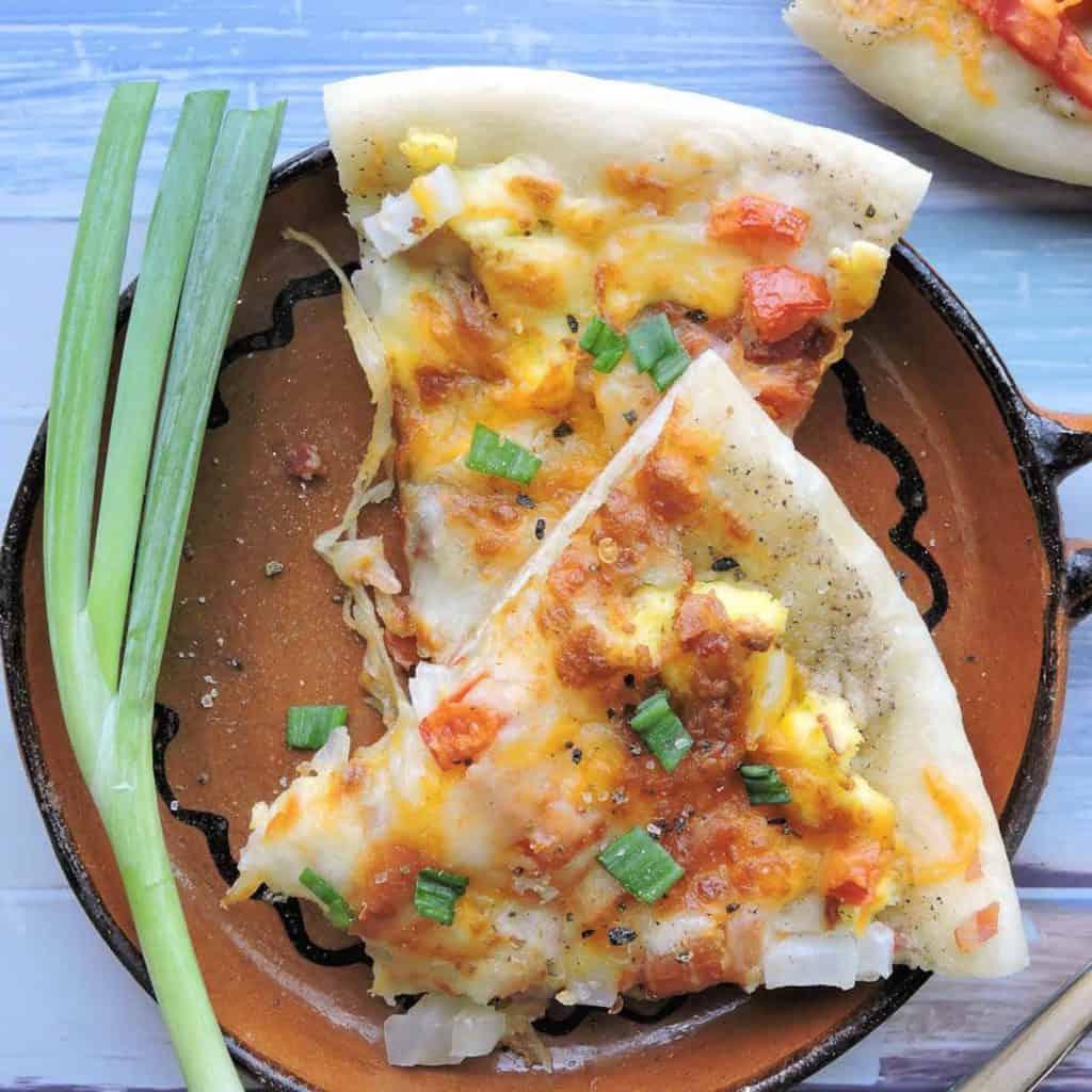 breakfast pizza slices on plate