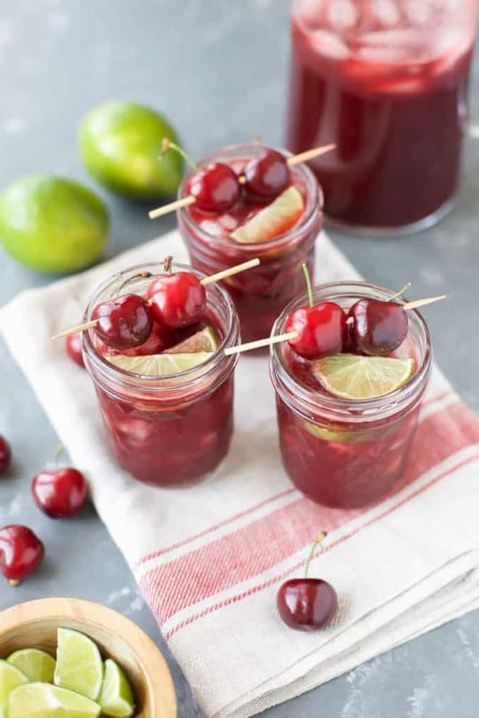 cherry margaritas on white and red towel