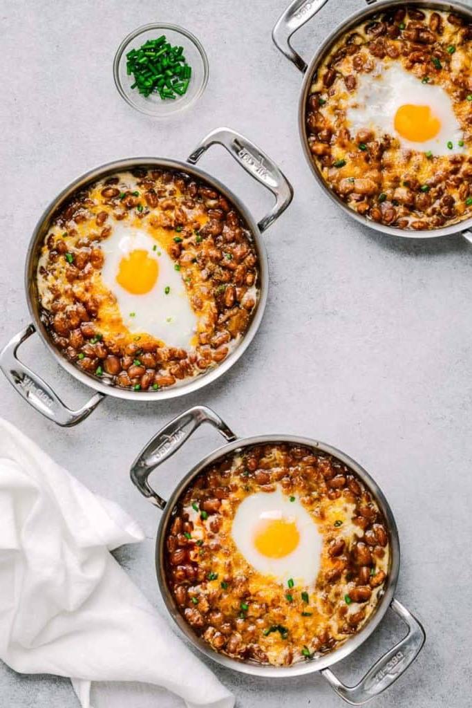 beans with overeasy eggs in individual pots