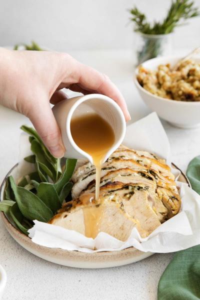 gravy being poured over instant pot turkey breast
