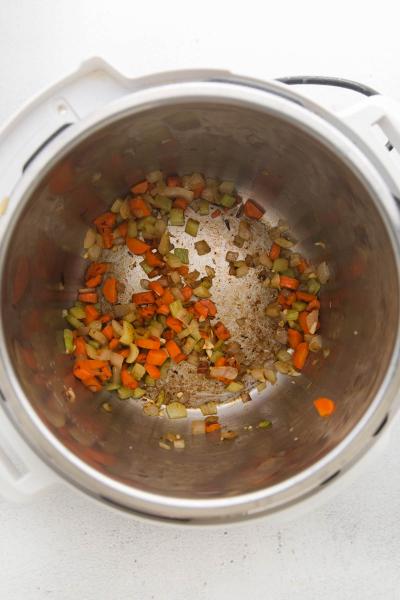 vegetables being sautéed in instant pot bowl